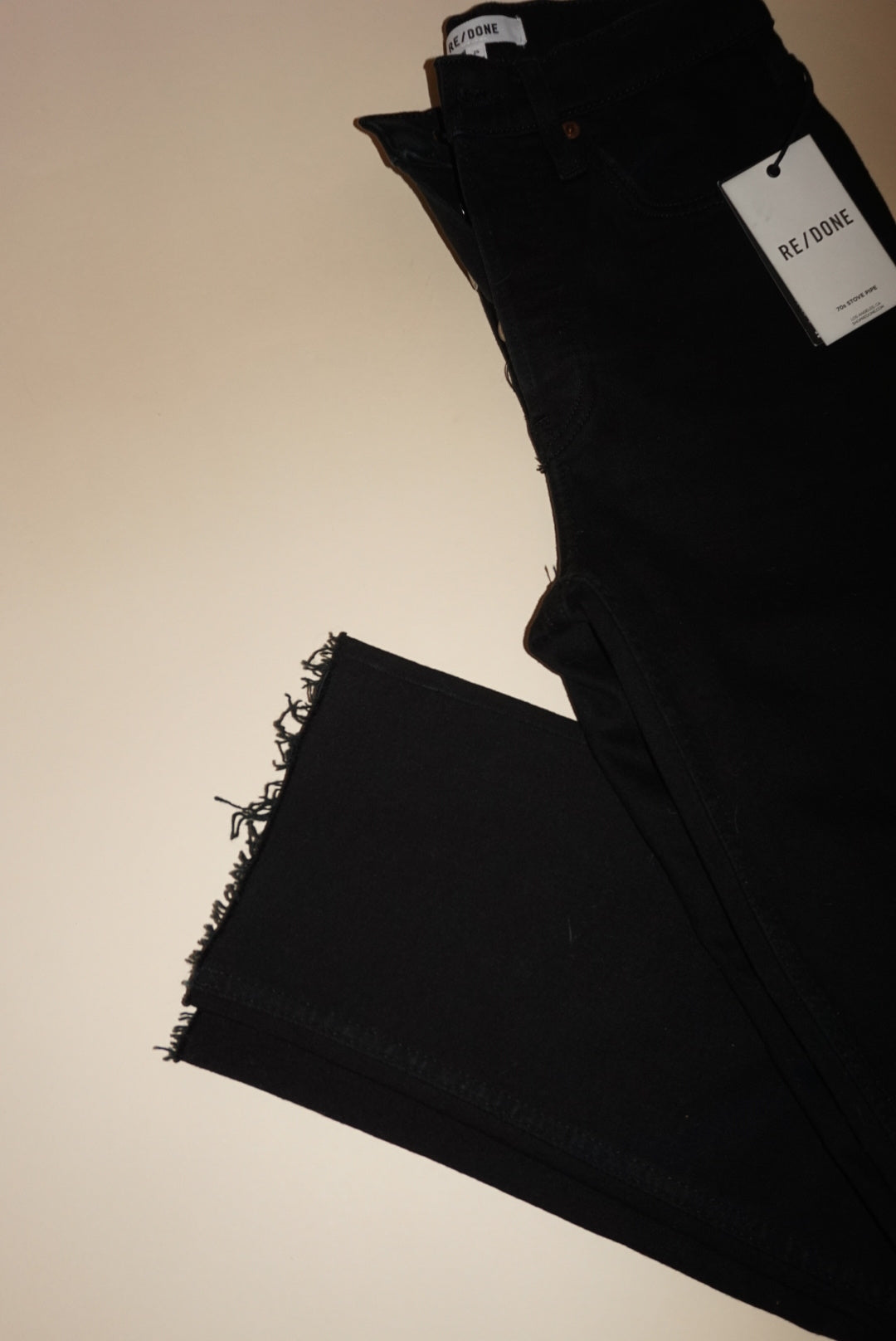 “Re/Done” Black Frayed Hem Jeans - Size 25